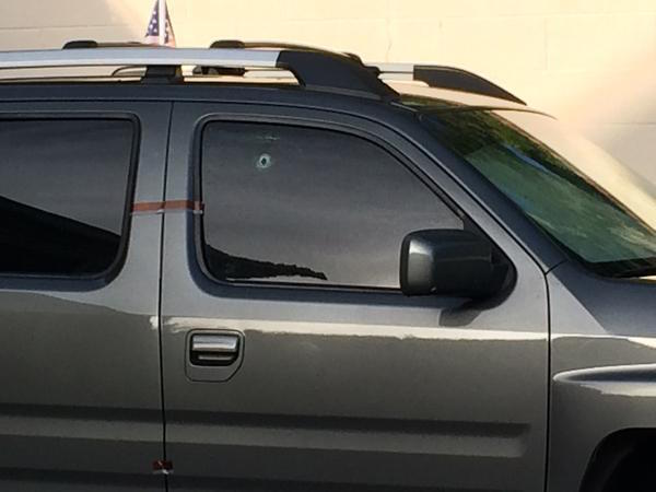 George Zimmerman SUV bullet hole 5-11-15