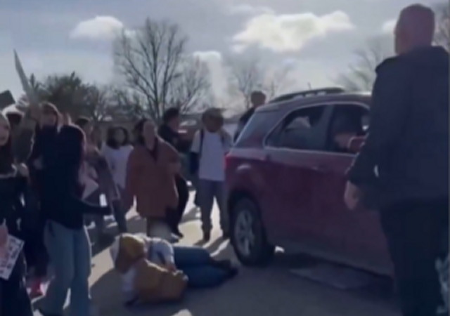 High School Student Protesting ICE Runs in Front of Car With Trump Flag ...