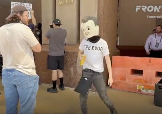 Left-Wing Activists Stage Mock Assassination of Charlie Kirk Outside TPUSA Event